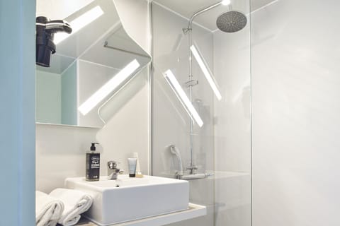Shower, rainfall showerhead, hair dryer, towels