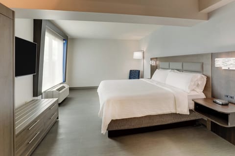 Premium bedding, desk, laptop workspace, blackout drapes