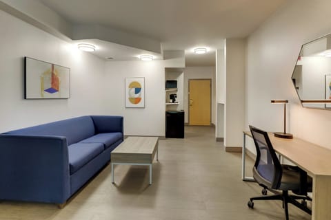 Premium bedding, desk, laptop workspace, blackout drapes