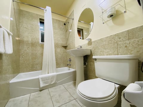 Standard Room, 2 Double Beds | Bathroom | Combined shower/tub, hair dryer, towels