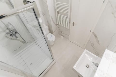 Hypo-allergenic bedding, desk, laptop workspace, blackout drapes