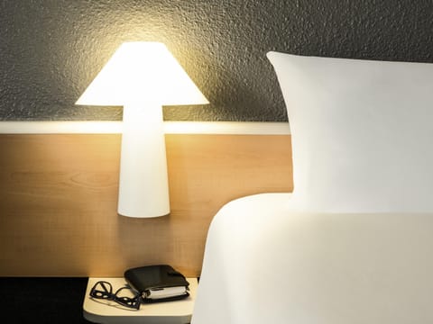 Premium bedding, desk, blackout drapes, soundproofing