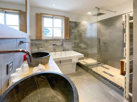 Family Suite | Bathroom | Designer toiletries, hair dryer, slippers, towels