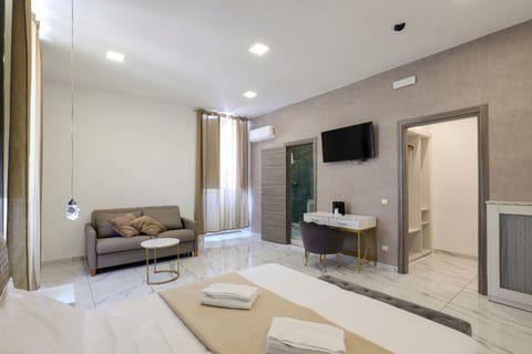Comfort Quadruple Room | In-room safe, desk, free WiFi, bed sheets