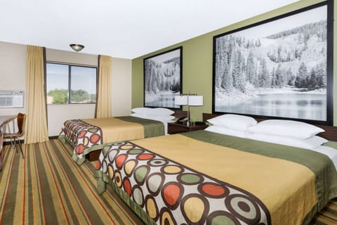 Desk, laptop workspace, iron/ironing board, free cribs/infant beds