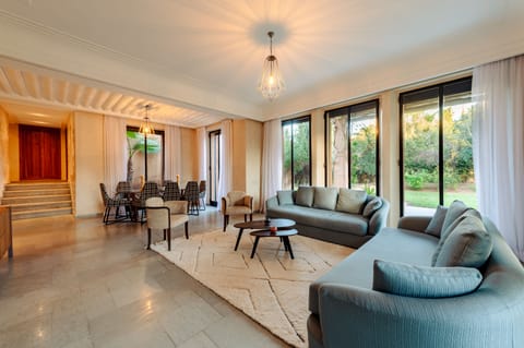 Deluxe Villa | Living area | Flat-screen TV