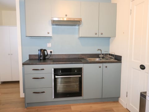 Fridge, electric kettle, toaster, cookware/dishes/utensils