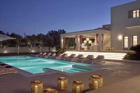 Seasonal outdoor pool, open 9:00 AM to 8:00 PM, pool umbrellas