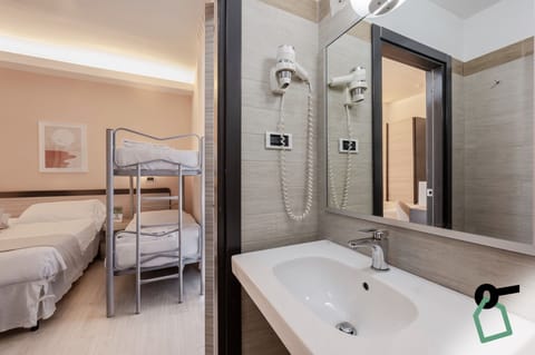 Quadruple Room | Bathroom | Hair dryer, bathrobes, bidet, towels