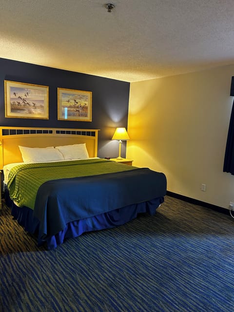 Standard Suite, 1 King Bed | In-room safe, desk, iron/ironing board, free WiFi