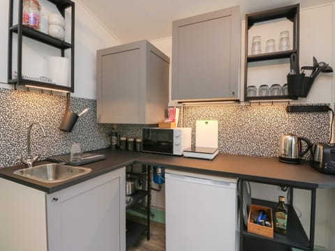 Fridge, electric kettle, toaster, cookware/dishes/utensils