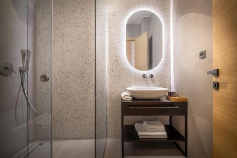 Shower, hair dryer, slippers, towels