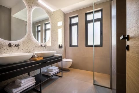 Shower, hair dryer, slippers, towels