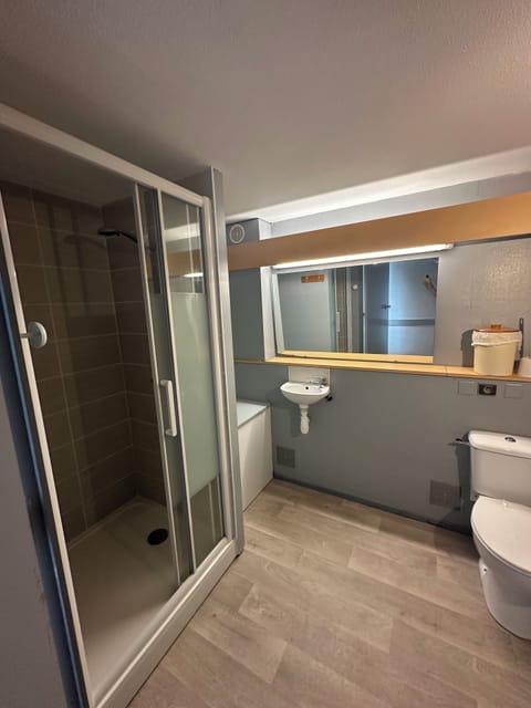 Bathtub, hair dryer, toilet paper