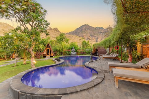 Outdoor pool, open 6:30 AM to 7:00 PM, free cabanas, pool umbrellas