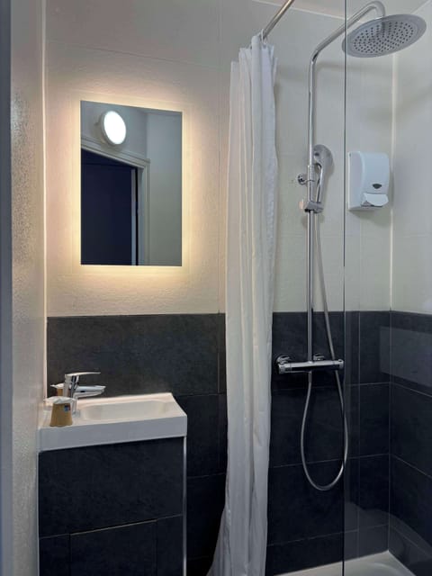 Shower, eco-friendly toiletries, hair dryer, towels