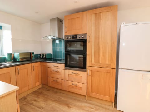 Fridge, electric kettle, toaster, cookware/dishes/utensils