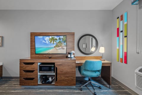 Desk, laptop workspace, blackout drapes, iron/ironing board