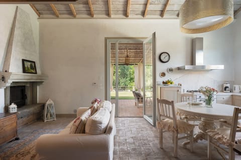 Exclusive Villa | Living area | 32-inch flat-screen TV with cable channels, TV, fireplace