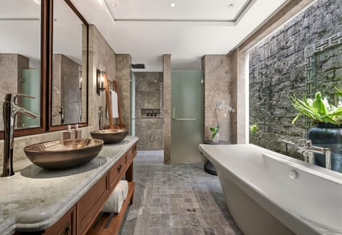 Separate tub and shower, free toiletries, hair dryer, slippers