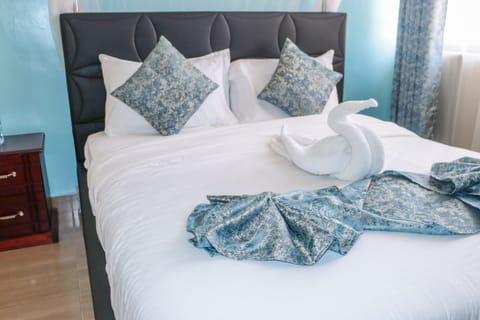 Premium bedding, desk, laptop workspace, free WiFi