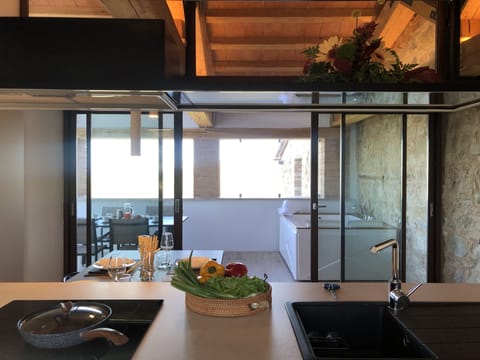 Luxury Apartment | Private kitchen | Full-size fridge, oven, stovetop, highchair