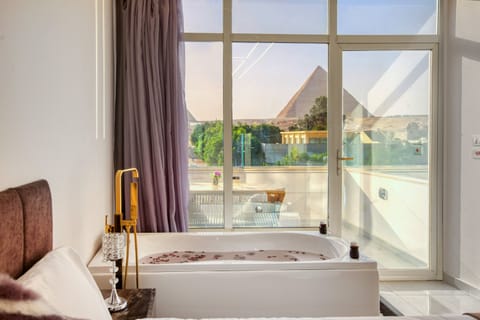 Luxury Studio Suite, 1 King Bed, Terrace, Mountain View | Minibar, in-room safe, desk, blackout drapes