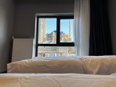 Family Quadruple Room, Multiple Beds, Non Smoking, City View | Egyptian cotton sheets, premium bedding, memory foam beds, minibar