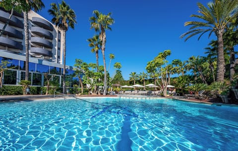 Outdoor pool, pool umbrellas, sun loungers