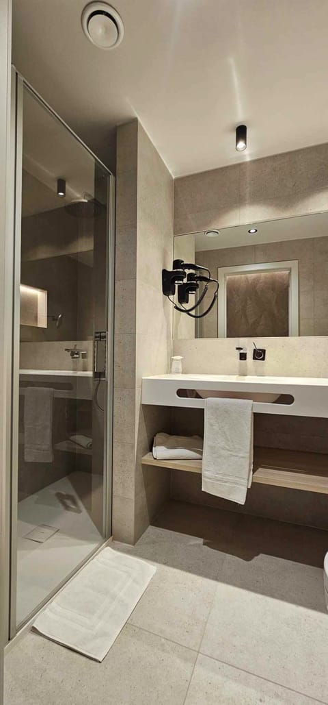 Standard Single Room | Bathroom | Designer toiletries, hair dryer, towels, soap