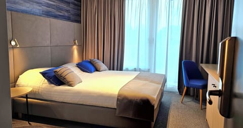 Executive Room | Premium bedding, minibar, in-room safe, individually decorated