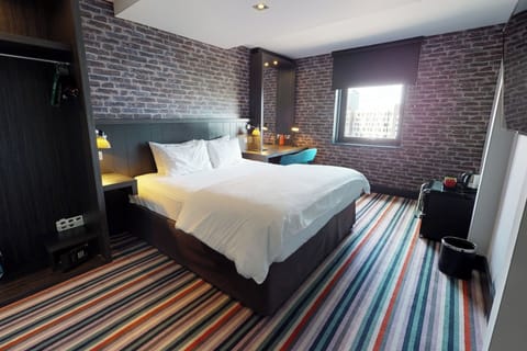 Desk, laptop workspace, blackout drapes, iron/ironing board