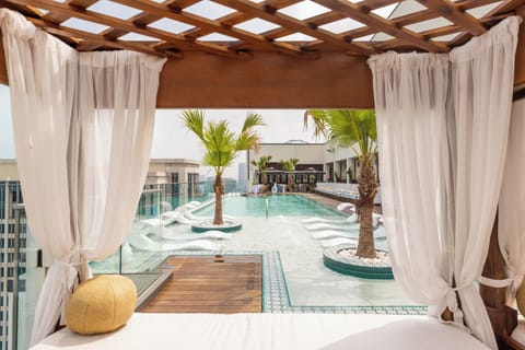 Outdoor pool, open 6:00 AM to 11:00 PM, pool umbrellas, sun loungers