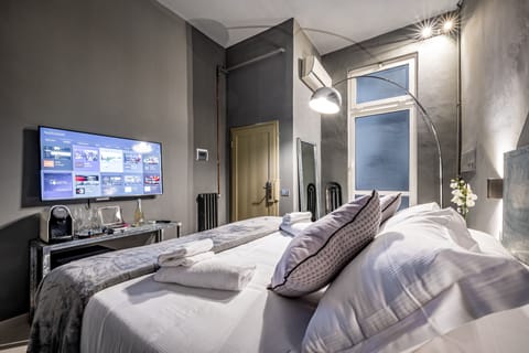 Superior Family Room | Minibar, in-room safe, individually furnished, iron/ironing board