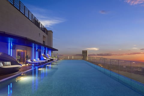 Outdoor pool, sun loungers, lifeguards on site