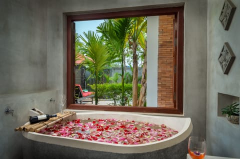 Suite Room Pool View | Bathroom | Separate tub and shower, deep soaking tub, rainfall showerhead