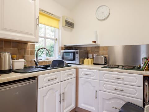 Fridge, electric kettle, toaster, cookware/dishes/utensils