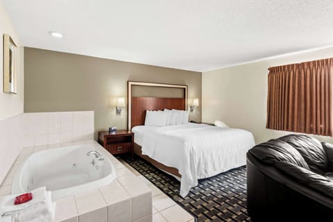Suite, 1 King Bed with Sofa bed, Non Smoking, Jetted Tub (with Sofabed) | Laptop workspace, blackout drapes, iron/ironing board