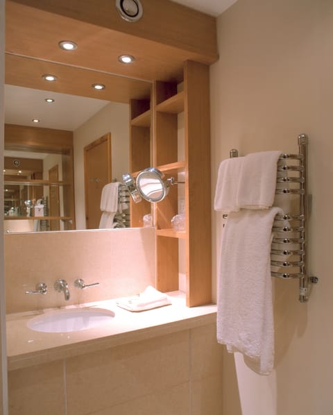 Designer toiletries, hair dryer, towels, shampoo