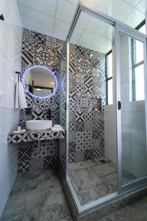 Superior Room | Bathroom | Hair dryer, towels, soap, shampoo