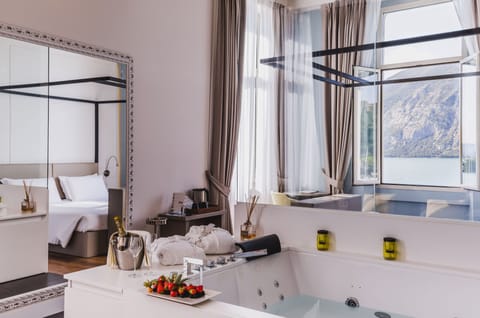 Junior Suite, Hot Tub, Lake View | Minibar, in-room safe, desk, laptop workspace