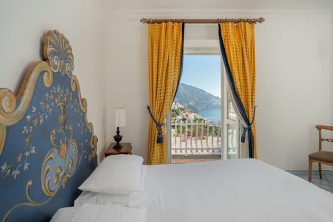 Deluxe Quadruple Room, Partial Sea View | Down comforters, minibar, in-room safe, desk