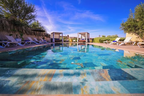 Outdoor pool, open 9:00 AM to 6:00 PM, pool umbrellas, sun loungers
