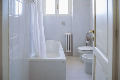 Panoramic Penthouse | Bathroom | Hair dryer, slippers, bidet, soap