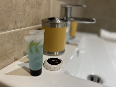 Shower, hydromassage showerhead, eco-friendly toiletries, hair dryer