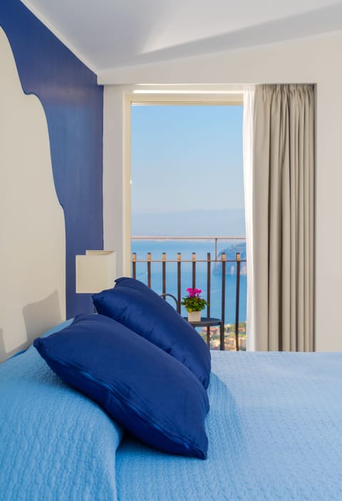 Deluxe Room, Terrace, Sea View | Down comforters, in-room safe, desk, blackout drapes