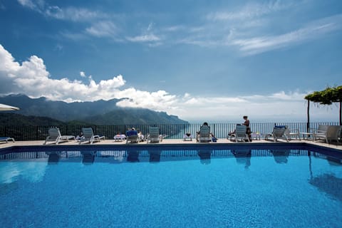 Seasonal outdoor pool, open 9:00 AM to 6:00 PM, sun loungers