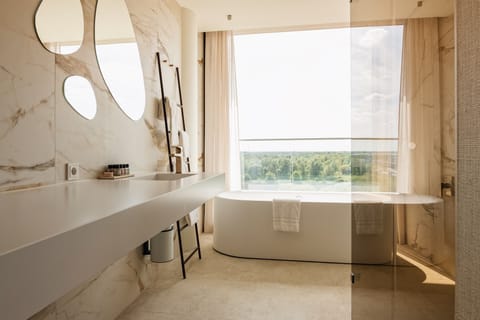 Superior Room | Bathroom | Hair dryer, towels, soap, shampoo