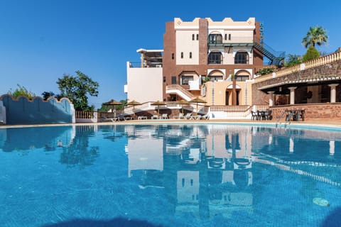 Outdoor pool, open 8 AM to 8 PM, pool umbrellas, sun loungers