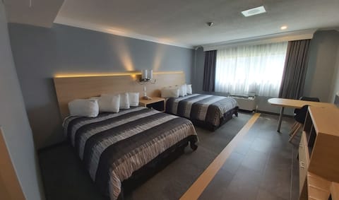 Desk, blackout drapes, iron/ironing board, free cribs/infant beds